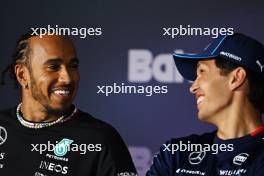 (L to R): Lewis Hamilton (GBR) Mercedes AMG F1 and Alexander Albon (THA) Williams Racing in the FIA Press Conference. 28.02.2024. Formula 1 World Championship, Rd 1, Bahrain Grand Prix, Sakhir, Bahrain, Preparation Day.