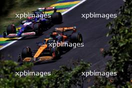 Oscar Piastri (AUS) McLaren MCL38 and Liam Lawson (NZL) RB VCARB 01. 01.11.2024. Formula 1 World Championship, Rd 21, Brazilian Grand Prix, Sao Paulo, Brazil, Sprint Qualifying Day.