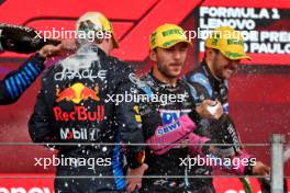 Pierre Gasly (FRA) Alpine F1 Team celebrates on the podium with Max Verstappen (NLD) Red Bull Racing and Esteban Ocon (FRA) Alpine F1 Team. 03.11.2024. Formula 1 World Championship, Rd 21, Brazilian Grand Prix, Sao Paulo, Brazil, Race Day.