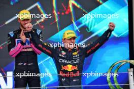 Race winner Max Verstappen (NLD) Red Bull Racing celebrates on the podium. 03.11.2024. Formula 1 World Championship, Rd 21, Brazilian Grand Prix, Sao Paulo, Brazil, Race Day.