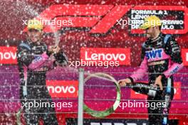 (L to R): Pierre Gasly (FRA) Alpine F1 Team celebrates his third position with second placed team mate Esteban Ocon (FRA) Alpine F1 Team on the podium. 03.11.2024. Formula 1 World Championship, Rd 21, Brazilian Grand Prix, Sao Paulo, Brazil, Race Day.