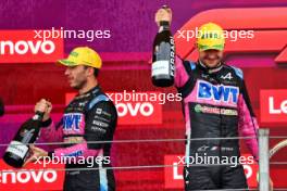 (L to R): Pierre Gasly (FRA) Alpine F1 Team celebrates his third position with second placed team mate Esteban Ocon (FRA) Alpine F1 Team on the podium. 03.11.2024. Formula 1 World Championship, Rd 21, Brazilian Grand Prix, Sao Paulo, Brazil, Race Day.