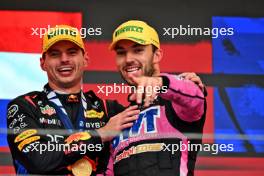 (L to R): Race winner Max Verstappen (NLD) Red Bull Racing celebrates with third placed Pierre Gasly (FRA) Alpine F1 Team on the podium. 03.11.2024. Formula 1 World Championship, Rd 21, Brazilian Grand Prix, Sao Paulo, Brazil, Race Day.