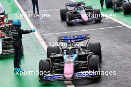 George Russell (GBR) Mercedes AMG F1 W15 congratulates second placed Esteban Ocon (FRA) Alpine F1 Team A524 and third placed Pierre Gasly (FRA) Alpine F1 Team A524 in parc ferme. 03.11.2024. Formula 1 World Championship, Rd 21, Brazilian Grand Prix, Sao Paulo, Brazil, Race Day.