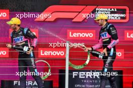 (L to R): Pierre Gasly (FRA) Alpine F1 Team celebrates his third position with second placed team mate Esteban Ocon (FRA) Alpine F1 Team on the podium. 03.11.2024. Formula 1 World Championship, Rd 21, Brazilian Grand Prix, Sao Paulo, Brazil, Race Day.