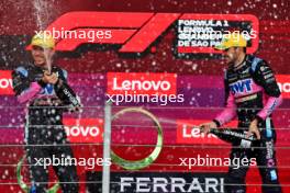 (L to R): Pierre Gasly (FRA) Alpine F1 Team celebrates his third position with second placed team mate Esteban Ocon (FRA) Alpine F1 Team on the podium. 03.11.2024. Formula 1 World Championship, Rd 21, Brazilian Grand Prix, Sao Paulo, Brazil, Race Day.