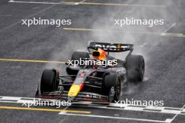 Race winner Max Verstappen (NLD) Red Bull Racing RB20 crosses the finish line at the end of the race. 03.11.2024. Formula 1 World Championship, Rd 21, Brazilian Grand Prix, Sao Paulo, Brazil, Race Day.