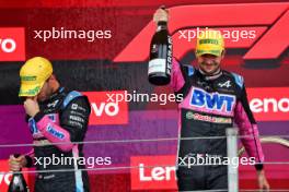 (L to R): Pierre Gasly (FRA) Alpine F1 Team celebrates his third position with second placed team mate Esteban Ocon (FRA) Alpine F1 Team on the podium. 03.11.2024. Formula 1 World Championship, Rd 21, Brazilian Grand Prix, Sao Paulo, Brazil, Race Day.