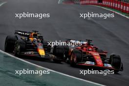 Max Verstappen (NLD) Red Bull Racing RB20 and Charles Leclerc (MON) Ferrari SF-24 battle for position. 03.11.2024. Formula 1 World Championship, Rd 21, Brazilian Grand Prix, Sao Paulo, Brazil, Race Day.