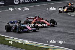 Esteban Ocon (FRA) Alpine F1 Team A524 and Charles Leclerc (MON) Ferrari SF-24 battle for position. 03.11.2024. Formula 1 World Championship, Rd 21, Brazilian Grand Prix, Sao Paulo, Brazil, Race Day.