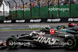 Lewis Hamilton (GBR) Mercedes AMG F1 W15 and Oliver Bearman (GBR) Haas VF-24 Reserve Driver battle for position. 03.11.2024. Formula 1 World Championship, Rd 21, Brazilian Grand Prix, Sao Paulo, Brazil, Race Day.