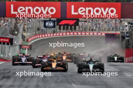 Lando Norris (GBR) McLaren MCL38 and George Russell (GBR) Mercedes AMG F1 W15 lead at the start of the race. 03.11.2024. Formula 1 World Championship, Rd 21, Brazilian Grand Prix, Sao Paulo, Brazil, Race Day.