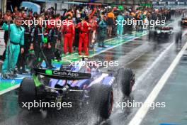 Yuki Tsunoda (JPN) RB VCARB 01 in the pits while the race is red flagged. 03.11.2024. Formula 1 World Championship, Rd 21, Brazilian Grand Prix, Sao Paulo, Brazil, Race Day.