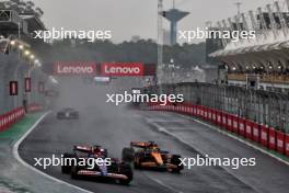 Liam Lawson (NZL) RB VCARB 01 and Oscar Piastri (AUS) McLaren MCL38 battle for position. 03.11.2024. Formula 1 World Championship, Rd 21, Brazilian Grand Prix, Sao Paulo, Brazil, Race Day.