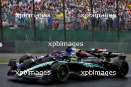 Lewis Hamilton (GBR) Mercedes AMG F1 W15 and Liam Lawson (NZL) RB VCARB 01 battle for position. 03.11.2024. Formula 1 World Championship, Rd 21, Brazilian Grand Prix, Sao Paulo, Brazil, Race Day.