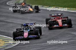 Esteban Ocon (FRA) Alpine F1 Team A524 and Charles Leclerc (MON) Ferrari SF-24 battle for position. 03.11.2024. Formula 1 World Championship, Rd 21, Brazilian Grand Prix, Sao Paulo, Brazil, Race Day.