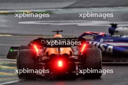 Liam Lawson (NZL) RB VCARB 01 and Oscar Piastri (AUS) McLaren MCL38 battle for position. 03.11.2024. Formula 1 World Championship, Rd 21, Brazilian Grand Prix, Sao Paulo, Brazil, Race Day.