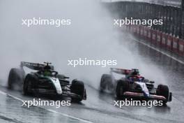 (L to R): Lewis Hamilton (GBR) Mercedes AMG F1 W15 and Liam Lawson (NZL) RB VCARB 01 battle for position. 03.11.2024. Formula 1 World Championship, Rd 21, Brazilian Grand Prix, Sao Paulo, Brazil, Race Day.