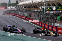 Pierre Gasly (FRA) Alpine F1 Team A524 and Max Verstappen (NLD) Red Bull Racing RB20 battle for position. 03.11.2024. Formula 1 World Championship, Rd 21, Brazilian Grand Prix, Sao Paulo, Brazil, Race Day.