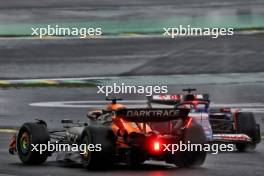 Liam Lawson (NZL) RB VCARB 01 and Oscar Piastri (AUS) McLaren MCL38 battle for position. 03.11.2024. Formula 1 World Championship, Rd 21, Brazilian Grand Prix, Sao Paulo, Brazil, Race Day.