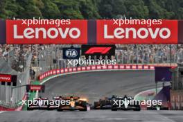 Lando Norris (GBR) McLaren MCL38 and George Russell (GBR) Mercedes AMG F1 W15 lead at the start of the race. 03.11.2024. Formula 1 World Championship, Rd 21, Brazilian Grand Prix, Sao Paulo, Brazil, Race Day.