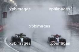 (L to R): Lewis Hamilton (GBR) Mercedes AMG F1 W15 and Liam Lawson (NZL) RB VCARB 01 battle for position. 03.11.2024. Formula 1 World Championship, Rd 21, Brazilian Grand Prix, Sao Paulo, Brazil, Race Day.