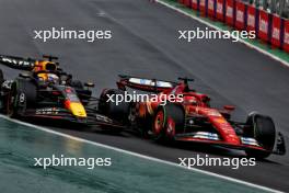 Max Verstappen (NLD) Red Bull Racing RB20 and Charles Leclerc (MON) Ferrari SF-24 battle for position. 03.11.2024. Formula 1 World Championship, Rd 21, Brazilian Grand Prix, Sao Paulo, Brazil, Race Day.