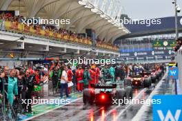 Fernando Alonso (ESP) Aston Martin F1 Team AMR24 in the pits while the race is red flagged. 03.11.2024. Formula 1 World Championship, Rd 21, Brazilian Grand Prix, Sao Paulo, Brazil, Race Day.