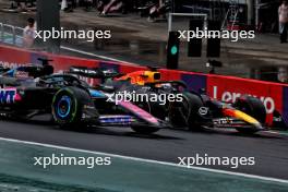 Esteban Ocon (FRA) Alpine F1 Team A524 and Max Verstappen (NLD) Red Bull Racing RB20 battle for the lead of the race. 03.11.2024. Formula 1 World Championship, Rd 21, Brazilian Grand Prix, Sao Paulo, Brazil, Race Day.