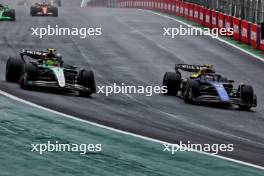 Lewis Hamilton (GBR) Mercedes AMG F1 W15 and Franco Colapinto (ARG) Williams Racing FW46 battle for position. 03.11.2024. Formula 1 World Championship, Rd 21, Brazilian Grand Prix, Sao Paulo, Brazil, Race Day.