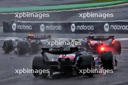 Esteban Ocon (FRA) Alpine F1 Team A524 and Max Verstappen (NLD) Red Bull Racing RB20 battle for the lead of the race. 03.11.2024. Formula 1 World Championship, Rd 21, Brazilian Grand Prix, Sao Paulo, Brazil, Race Day.