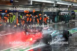 George Russell (GBR) Mercedes AMG F1 W15 leaves the pits ahead of Lando Norris (GBR) McLaren MCL38. 03.11.2024. Formula 1 World Championship, Rd 21, Brazilian Grand Prix, Sao Paulo, Brazil, Race Day.