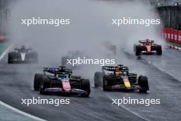 Esteban Ocon (FRA) Alpine F1 Team A524 and Max Verstappen (NLD) Red Bull Racing RB20 battle for the lead of the race. 03.11.2024. Formula 1 World Championship, Rd 21, Brazilian Grand Prix, Sao Paulo, Brazil, Race Day.