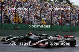 Lewis Hamilton (GBR) Mercedes AMG F1 W15 and Oliver Bearman (GBR) Haas VF-24 Reserve Driver battle for position. 03.11.2024. Formula 1 World Championship, Rd 21, Brazilian Grand Prix, Sao Paulo, Brazil, Race Day.