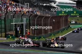 Oliver Bearman (GBR) Haas VF-24 Reserve Driver and Sergio Perez (MEX) Red Bull Racing RB20 battle for position. 02.11.2024. Formula 1 World Championship, Rd 21, Brazilian Grand Prix, Sao Paulo, Brazil, Sprint and Qualifying Day.