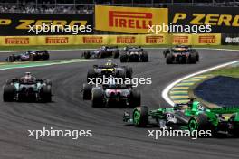 Lewis Hamilton (GBR) Mercedes AMG F1 W15 and Esteban Ocon (FRA) Alpine F1 Team A524 at the start of Sprint. 02.11.2024. Formula 1 World Championship, Rd 21, Brazilian Grand Prix, Sao Paulo, Brazil, Sprint and Qualifying Day.