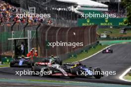 Nico Hulkenberg (GER) Haas VF-24 and Alexander Albon (THA) Williams Racing FW46 battle for position. 02.11.2024. Formula 1 World Championship, Rd 21, Brazilian Grand Prix, Sao Paulo, Brazil, Sprint and Qualifying Day.