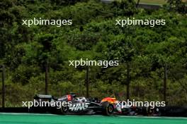 Oliver Bearman (GBR) Haas VF-24 Reserve Driver and Sergio Perez (MEX) Red Bull Racing RB20 battle for position. 02.11.2024. Formula 1 World Championship, Rd 21, Brazilian Grand Prix, Sao Paulo, Brazil, Sprint and Qualifying Day.