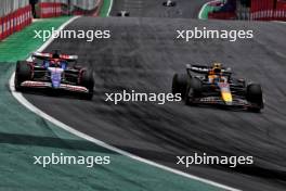 Liam Lawson (NZL) RB VCARB 01 and Sergio Perez (MEX) Red Bull Racing RB20 battle for position. 02.11.2024. Formula 1 World Championship, Rd 21, Brazilian Grand Prix, Sao Paulo, Brazil, Sprint and Qualifying Day.