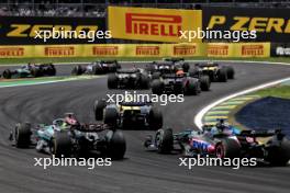 Lewis Hamilton (GBR) Mercedes AMG F1 W15 and Esteban Ocon (FRA) Alpine F1 Team A524 at the start of Sprint. 02.11.2024. Formula 1 World Championship, Rd 21, Brazilian Grand Prix, Sao Paulo, Brazil, Sprint and Qualifying Day.