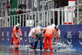 Circuit atmosphere - marshals try to sweep rain water from the pit lane. 02.11.2024. Formula 1 World Championship, Rd 21, Brazilian Grand Prix, Sao Paulo, Brazil, Sprint and Qualifying Day.