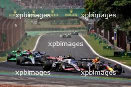 Oliver Bearman (GBR) Haas VF-24 Reserve Driver and Sergio Perez (MEX) Red Bull Racing RB20 at the start of Sprint. 02.11.2024. Formula 1 World Championship, Rd 21, Brazilian Grand Prix, Sao Paulo, Brazil, Sprint and Qualifying Day.