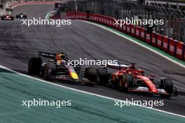 Max Verstappen (NLD) Red Bull Racing RB20 and Charles Leclerc (MON) Ferrari SF-24 battle for position. 02.11.2024. Formula 1 World Championship, Rd 21, Brazilian Grand Prix, Sao Paulo, Brazil, Sprint and Qualifying Day.