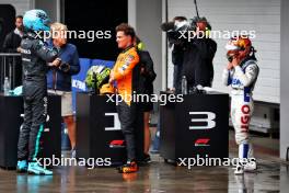 Qualifying top three in parc ferme (L to R): George Russell (GBR) Mercedes AMG F1, second; Lando Norris (GBR) McLaren, pole position; Yuki Tsunoda (JPN) RB, third. 03.11.2024. Formula 1 World Championship, Rd 21, Brazilian Grand Prix, Sao Paulo, Brazil, Race Day.