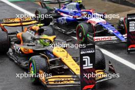 Pole sitter Lando Norris (GBR) McLaren MCL38 and third placed Yuki Tsunoda (JPN) RB VCARB 01 in qualifying parc ferme. 03.11.2024. Formula 1 World Championship, Rd 21, Brazilian Grand Prix, Sao Paulo, Brazil, Race Day.