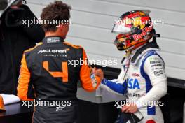 (L to R): Lando Norris (GBR) McLaren celebrates his pole position in qualifying parc ferme with third placed Yuki Tsunoda (JPN) RB. 03.11.2024. Formula 1 World Championship, Rd 21, Brazilian Grand Prix, Sao Paulo, Brazil, Race Day.