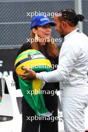 Lewis Hamilton (GBR) Mercedes AMG F1 with Viviane Senna (BRA) - McLaren MP4/5B - demonstration run. 03.11.2024. Formula 1 World Championship, Rd 21, Brazilian Grand Prix, Sao Paulo, Brazil, Race Day.