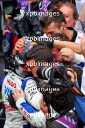 Yuki Tsunoda (JPN) RB celebrates his third position in qualifying parc ferme with the team. 03.11.2024. Formula 1 World Championship, Rd 21, Brazilian Grand Prix, Sao Paulo, Brazil, Race Day.