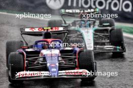 Yuki Tsunoda (JPN) RB VCARB 01 and George Russell (GBR) Mercedes AMG F1 W15. 03.11.2024. Formula 1 World Championship, Rd 21, Brazilian Grand Prix, Sao Paulo, Brazil, Race Day.