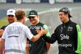 Sebastian Vettel (GER) with Valtteri Bottas (FIN) Sauber and Zhou Guanyu (CHN) Sauber. 31.10.2024. Formula 1 World Championship, Rd 21, Brazilian Grand Prix, Sao Paulo, Brazil, Preparation Day.